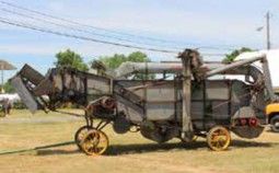 Antique threshing machine on the infield