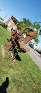 Rusty antique implement on the grass
