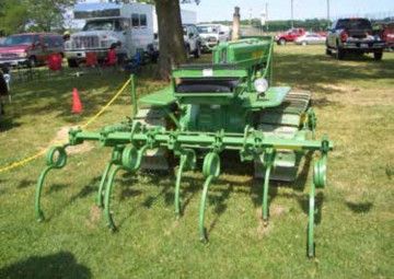 John Deere crawler with a cultivator