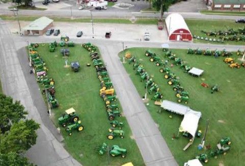 Aerial view of rows of John Deere tractors on the Expo grounds